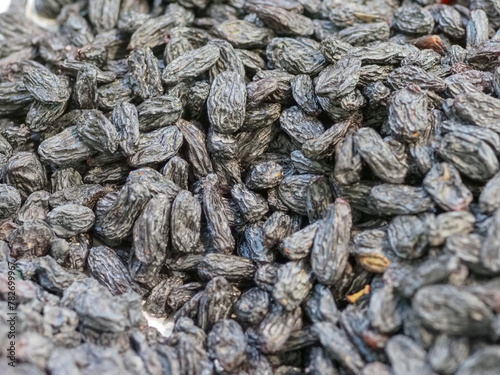 Dark Raisins Displayed on an Eastern Sweets Shop Counter: Vibrant Color and Unmatched Flavor