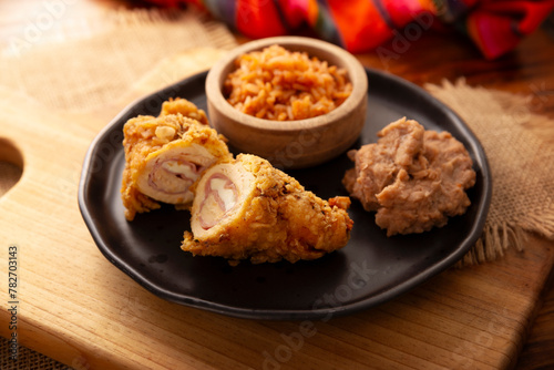 Chicken Cordon Bleu. Chicken breast meat wrapped with ham and cheese, breaded and fried or baked. Also known as schnitzel cordon bleu, a very popular recipe in many countries.