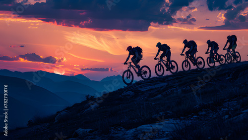 Mountain Bikers on Rocky Ridge at Dusk