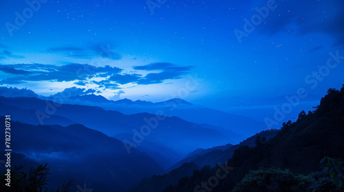 The peaceful tranquility of the night is broken only by the faint sound of crickets and the gentle kiss of moonlight on the mountain . .