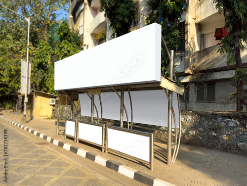 A perspective view of bus stop in Mumbai, India with blank empty place for commercial banner mockup billboard, ooh, outdoor. Indian bus stop mock-up for branding. A complete bus stop for advertising.