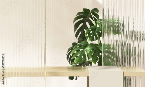 Gold luxury counter table podium, monstera plant, reeded fluted glass partition in sunlight on beige wall for modern, elegant fashion, beauty, cosmetic, skincare, body care, product background 3D © Sue Tansirimas