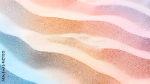 A colorful sand dune with a rainbow of colors. The sand is a mix of brown, pink, and blue