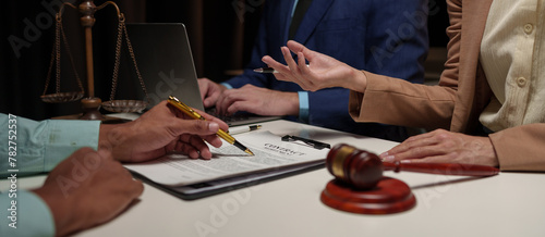 A lawyer, investor, businessman, or entrepreneur is reviewing a business contract or insurance contract for future benefits or a businessman signs a document and receives a loan.