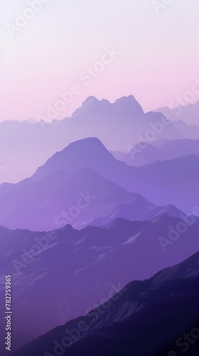 A hazy purple mountain range peaks in the distance. Wallpaper. Background. © keystoker