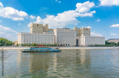 View of the Ministry of Defence of Russian Federation, and Moscow river embakment with cruise ships at sunset. photo