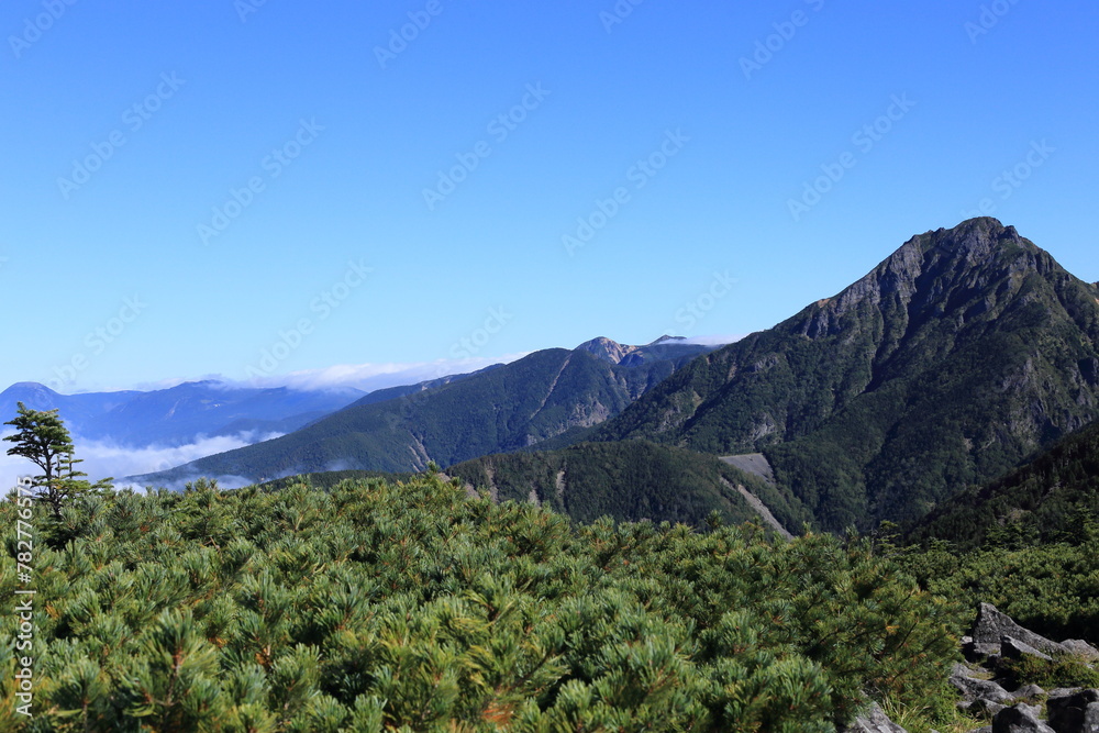 Mt.Amida and Yatsugatake mountains seen from the top of Mt.Amigasa