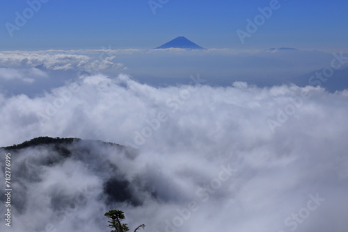 Mt.fuji floating in the sea of clouds seen from the top of Mt.Amigasa