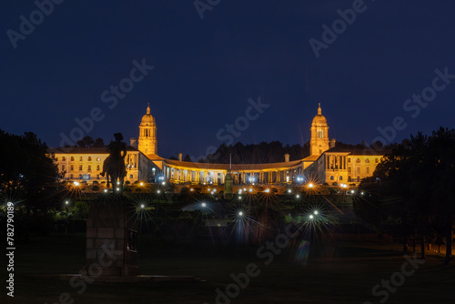 Nighttime photograph of the Union Buildings in Pretoria, Gauteng, South Africa, with stars visible in the sky
