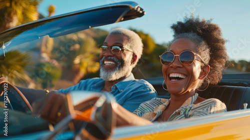 Visualize a dynamic, mixed-race couple in their 60s, setting out on a road trip in their electric car, surrounded by the vibrant greens of the American countryside in spring.