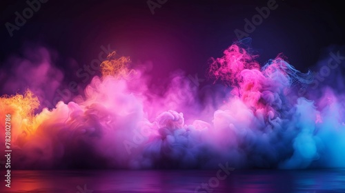 Abstract smoke clouds with vibrant pink, yellow, and blue hues against a dark background, creating a dreamlike atmosphere. © tashechka