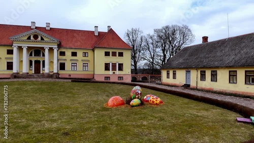 Durbe Castle Garden Decorated With Colorful Giant Eggs For Easter Celebration In Estonia, Latvia. Static Shot photo
