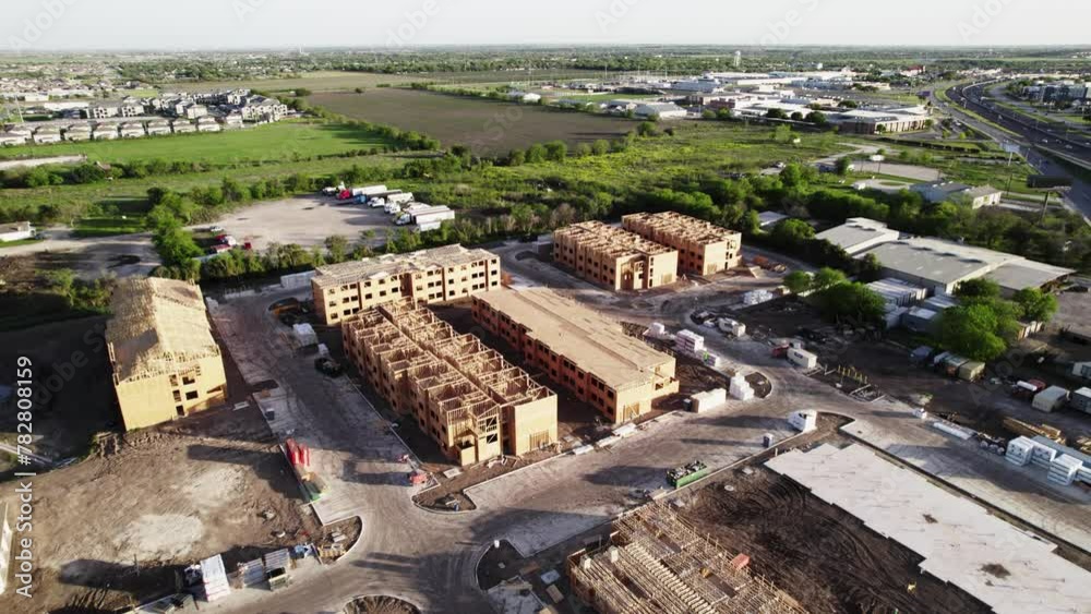 aerial view of new development being built at a construction site aerial view of new development being built at a construction site