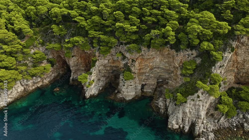 Adriatic Sea, Croatia - The Breathtaking Steep Rugged Cliffs of Kalamota Island - Aerial Drone Shot Adriatic Sea, Croatia - The Breathtaking Steep Rugged Cliffs of Kalamota Island - Aerial Drone Shot