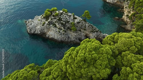 Kalamota Island, Adriatic Sea, Croatia - A Scenic View of Crystal-clear Blue Waters and Verdant Rock Cliffs - Aerial Drone Shot photo