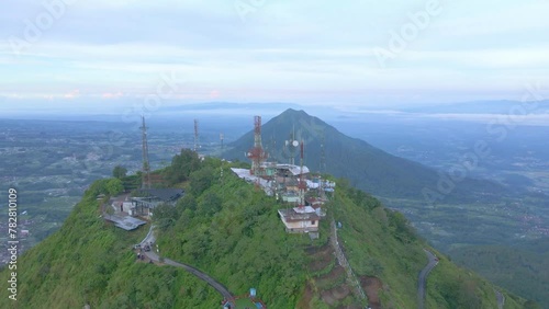 Aerial view of telecommunications  tower on a mountain peak. Telomoyo Mountain, Central Java, Indonesia. photo