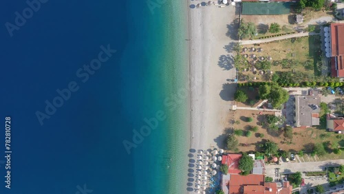 Aerial: Top down drone shot of Panormos beach at Skopelos island in Greece photo