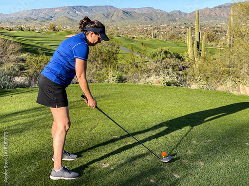 Woman Golfing on Desert Golf Course