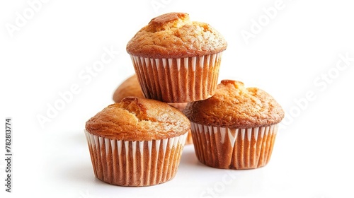 A stack of freshly baked muffins, still warm from the oven, with golden tops and tender crumb inside. Isolated on pure white background.