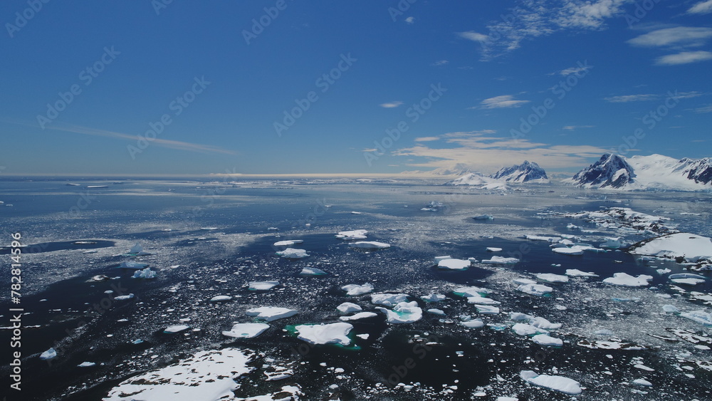 Obraz premium Arctic Epic Ocean Mountain Landscape Aerial View. North Antarctica Open Water Coast Majestic Landscape Overview. Global Warming Nature Concept Drone Flight