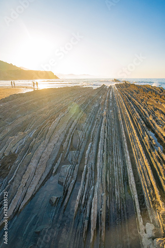 Sunset view of the landscape at beach in Zumaia, Basque, Spain. photo