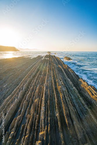 Sunset view of the landscape at beach in Zumaia, Basque, Spain. photo