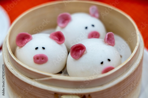 Pig-shaped Chinese red bean buns at restaurant
