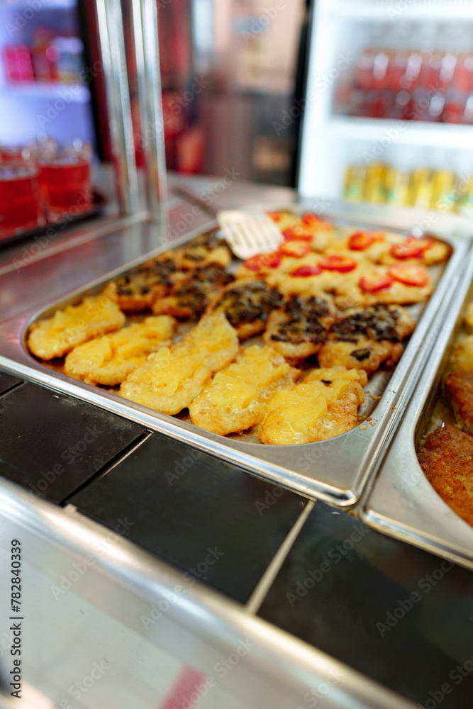 Bustling Cafeteria Serving Line During Lunchtime Offering a Variety of Dishes