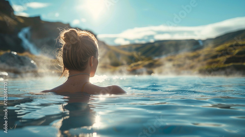 Young woman enjoying spa in hot springs in iceland © Alexander