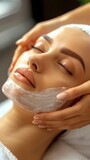 Facial Spa Treatment: Woman with Face Mask and Manicured Hands