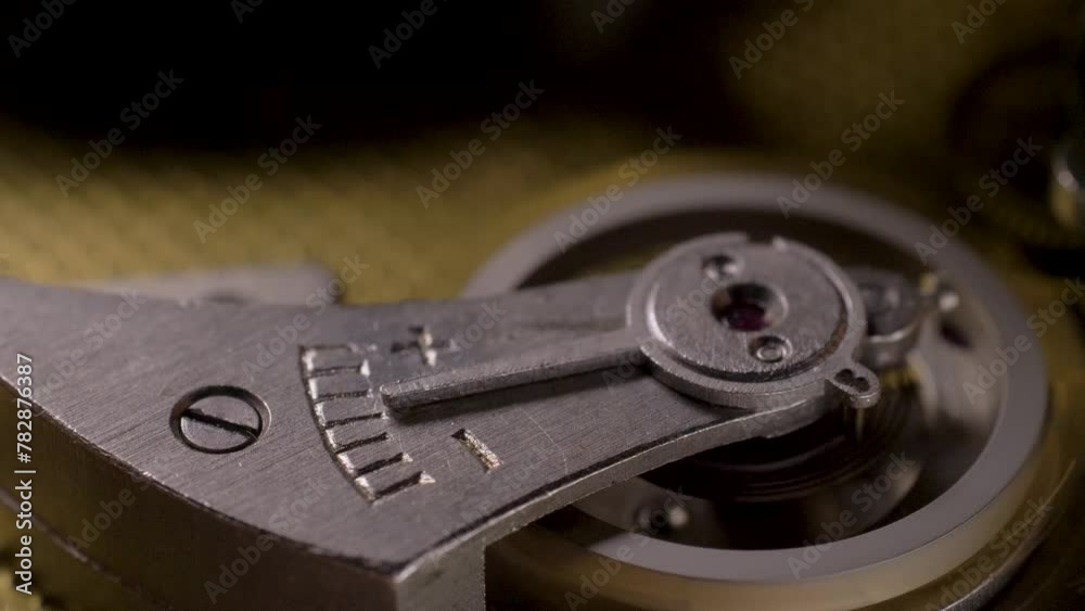 Inside of mechanic watch. Old clock mechanism works. Successful business or teamwork. Mechanical watches, time gears concept. Gears and springs component plays crucial role in synchronizing movement Inside of mechanic watch. Old clock mechanism works. Successful business or teamwork. Mechanical watches, time gears concept. Gears and springs component plays crucial role in synchronizing movement
