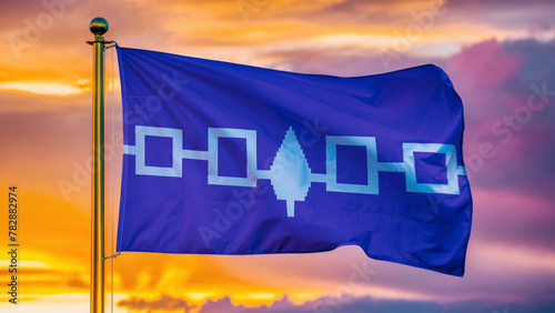 Iroquois Confederacy Waving Flag Against a Cloudy Sky at Sunset. photo