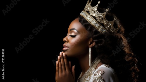 Praying African woman wearing tiara and clasping her hands together on dark background. Fictional Character Created by Generative AI. photo