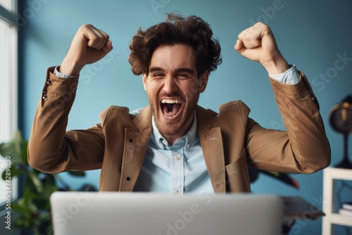 real, gorgeous happy male celebrating because because his sales increased in social media photo