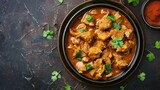 Top View of Homemade spicy chicken curry served in bowl, inviting the viewer to enjoy a serving of this delectable dish.