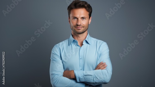 Handsome smiling business man isolated on gray background 