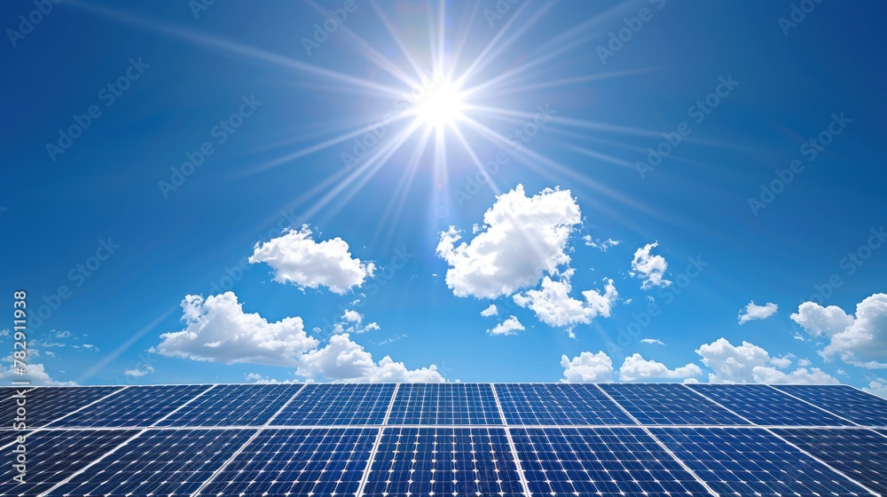Solar panels against a bright animated cloud sky background. 