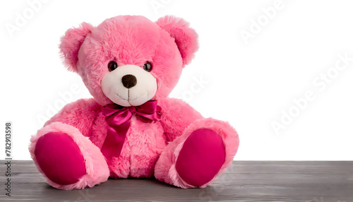 Seated pink teddy bear on white background. Soft cure fluffy plush toy. Stuffed animal. © Patrick Helmholz