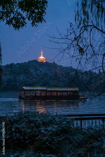 Vertical of the illuminated Ling Jiou Buddhist temple on a mountain in Taipei, Taiwan in the evening photo