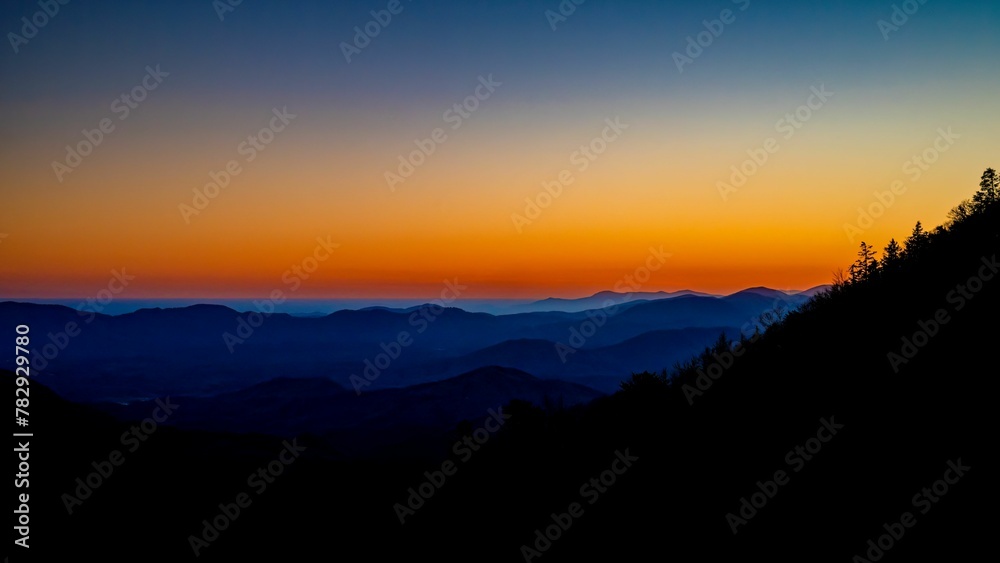 Fototapeta premium Beautiful dusk view over mountain silhouettes, can be used for wallpaper