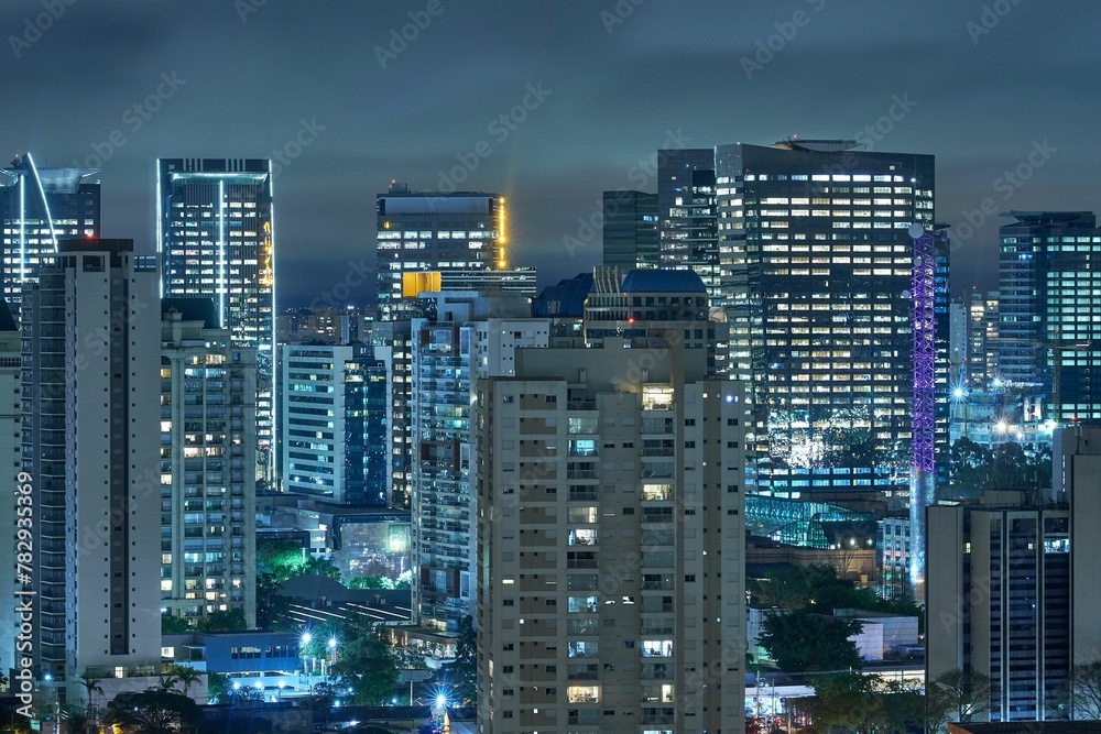 Rooftop view of illuminated Sao Paulo buildings at night in Brazil