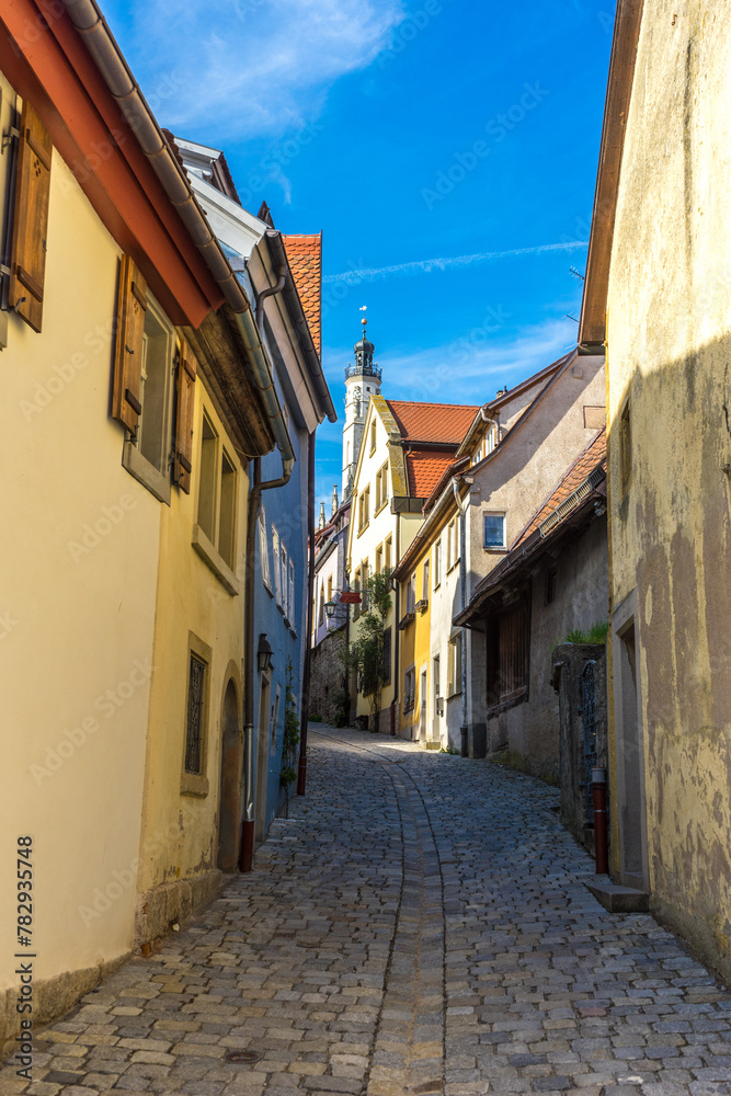 Vertical shot of the narrow street between the buildings in Rothenberg ob der Tauber, Germany