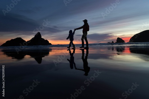 Mom and daughter at the Beach Brookings Oregon at sunset photo