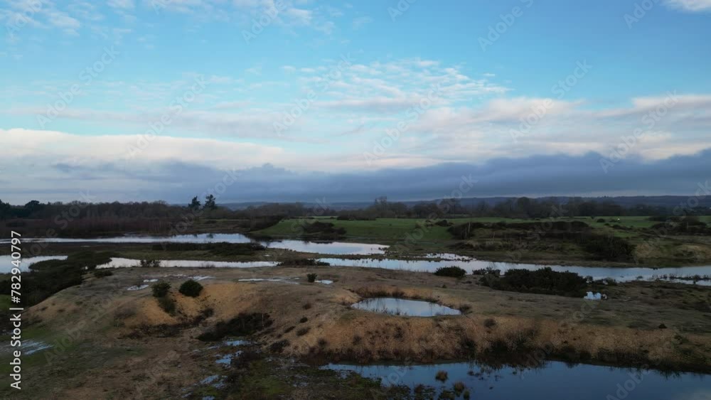 Aerial view of water ponds with a cloudy sky in the background, Greenham, England Aerial view of water ponds with a cloudy sky in the background, Greenham, England