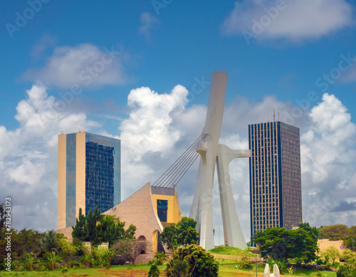 The modern skyline of the plateau district of Abidjan with St. Paul Cathedral in the foreground Abidjan, Côte d'ivoire (Ivory Coast), West Africa