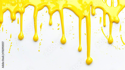 Lemon yellow paint drip on a pure white background photo