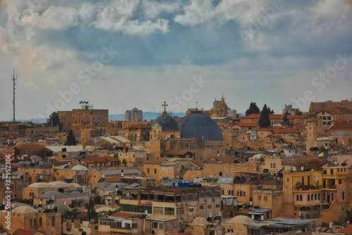 Landscape view of the old city of Jerusalem with cloudy sky in background