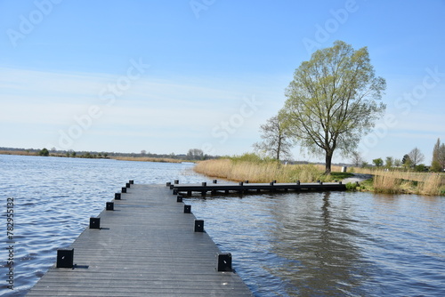 Empty jetty in the lake in the daytime © Wirestock