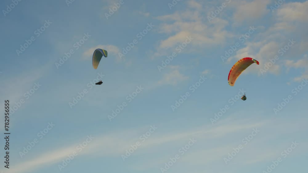 Paragliders flying at the sunset in Puerto de la Cruz, Tenerife Paragliders flying at the sunset in Puerto de la Cruz, Tenerife