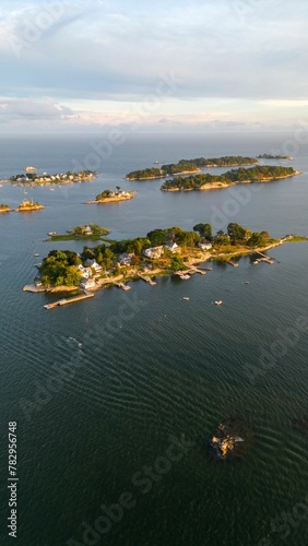 Vertical aerial shot of Thimble Islands in Branford with a beautiful waterscape and a skyline photo